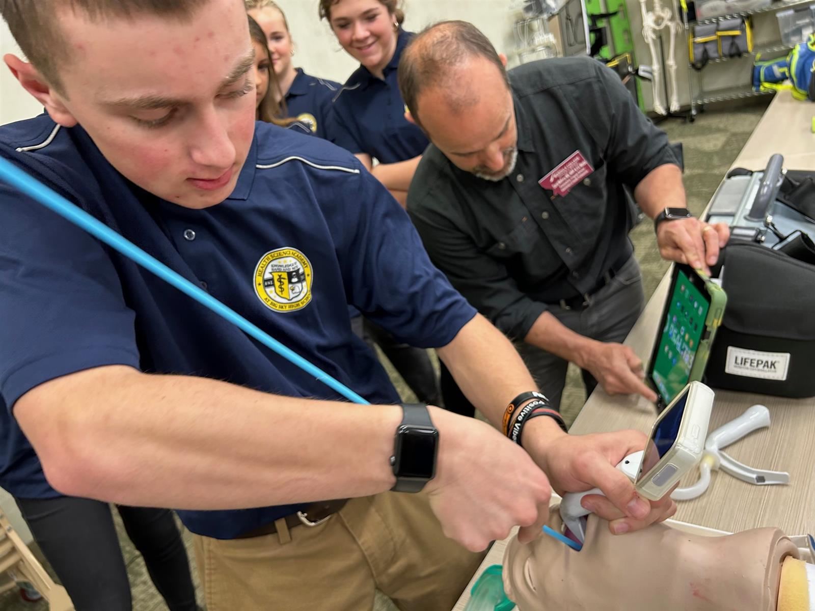 HSA freshmen practice administering a tracheostomy with thehelp of Missoula College's Emergency Medicine educators.