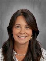 Principal Thennis wearing white