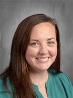 Image of athletic Secretary Alex wearing green